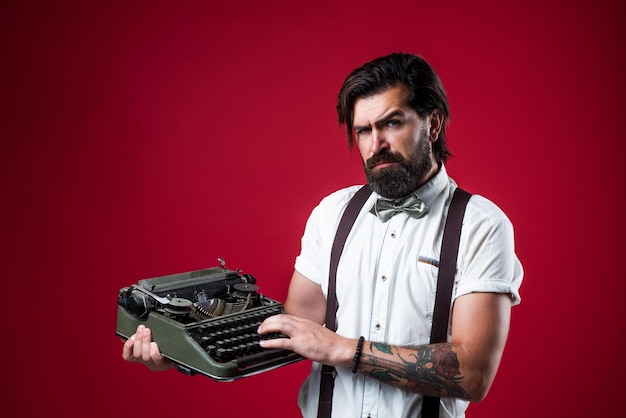 Use technology in modern life true gentleman with groomed hair reporter or journalist bearded man in suspenders with retro typewriter elegant businessman typist wear bow tie