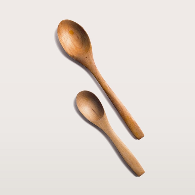 Used brown wooden spoon with flat lay concept isolated on white background