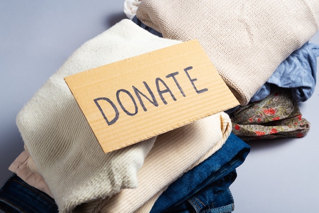 Used denim jeans and clothes for donation, donate sign