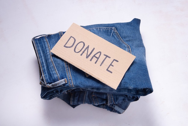 Used denim jeans for donation, donate sign