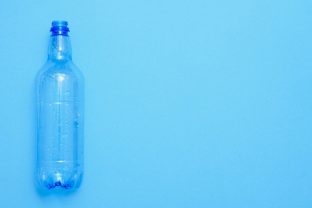 Used plastic bottles on the blue background