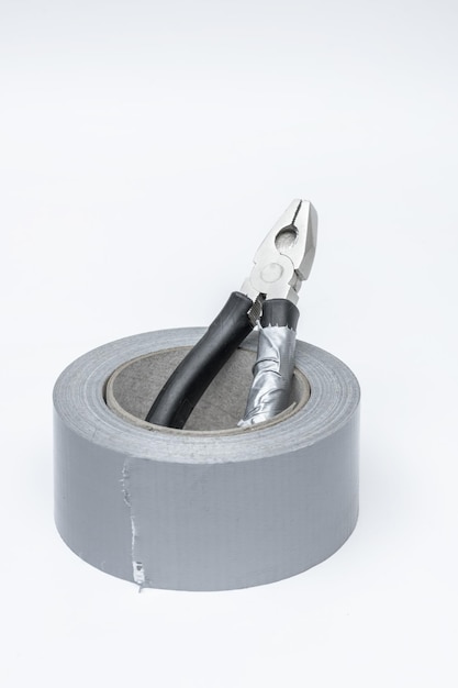 A used pliers inside a roll of gray