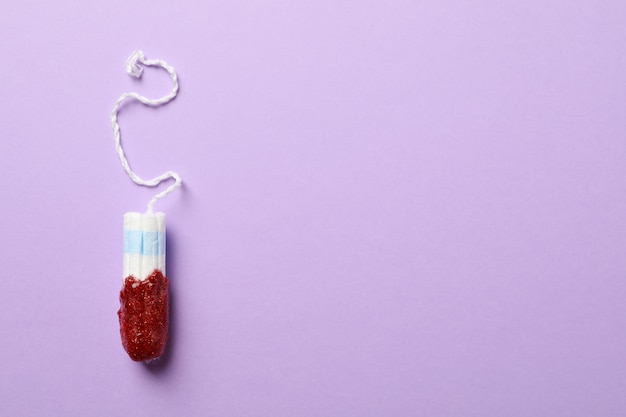 Photo used tampon on violet surface