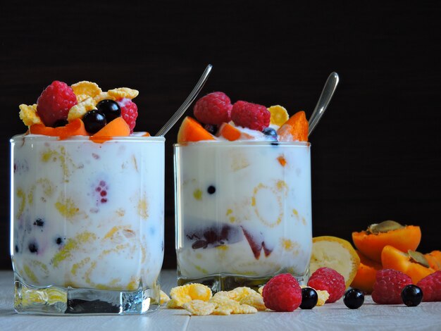 Useful breakfast with fruit berries flakes and yogurt. berries\
fruit flakes.