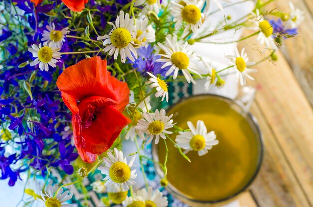 Useful and medicinal herbal tea and flowers in a cup
