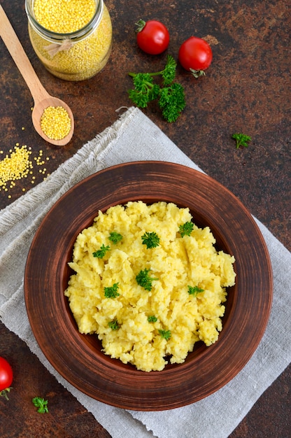 Useful millet porridge in a clay bowl. Lenten menu. Vegan Dishes