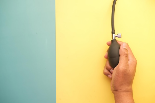 Using blood pressure machine on color background