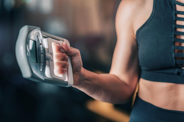 Photo using hand dynamometer for grip strength test