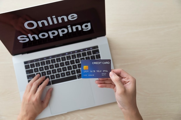 Using laptop and credit card online shopping