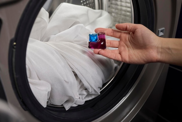 Using Laundry Detergent Pods While Doing Laundry in the Washing Machine with Clothes