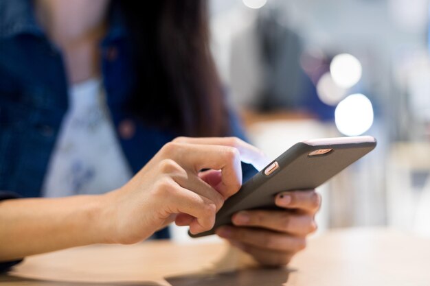 Using smart phone in the coffee shop