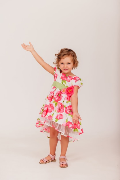 ÃÂÃÂ¡ute 4-5 year old girl in style dress on white isolated background looks at camera