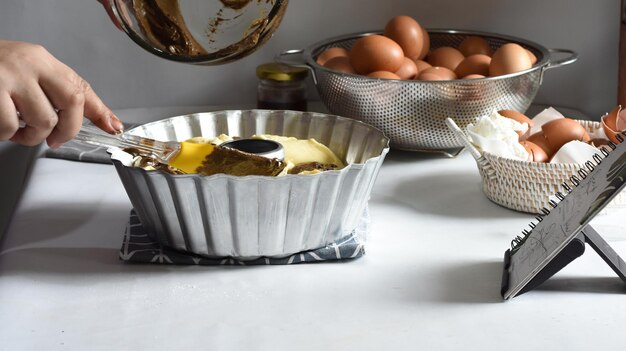 utensils and ingredients for cake preparation on white background
Baking cooking concept