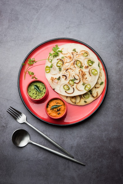 Uthappam or uttapam is a type of dosa from South India which is thicker, with tomato, onion and chilli toppings