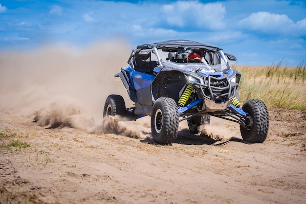 UTV in action offroad vehicle racing on the sand dune Extreme adrenalin 4x4