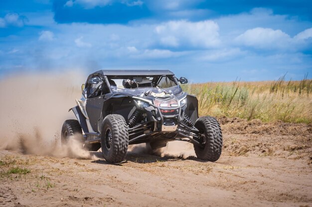 UTV in action offroad vehicle racing on sand dune Extreme adrenalin 4x4