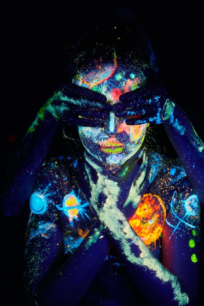 UV painting of a universe on a female body portrait