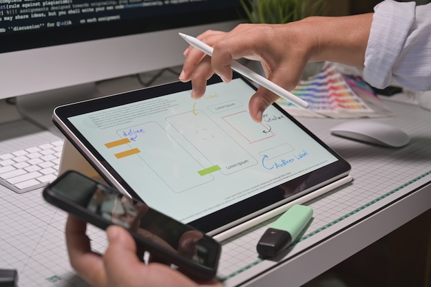 UX designers creative sketch planning application development prototype for mobile application