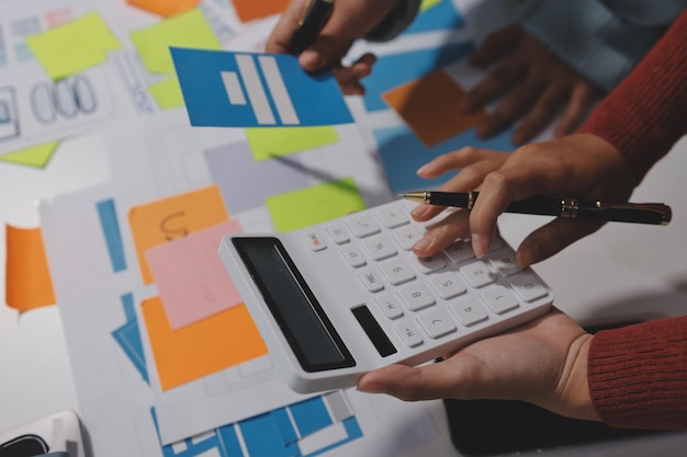 ux ui designer testing prototype on a phone discussing and brainstorming on wireframes for a website and mobile app prototype in the concept of website and mobile application design concept