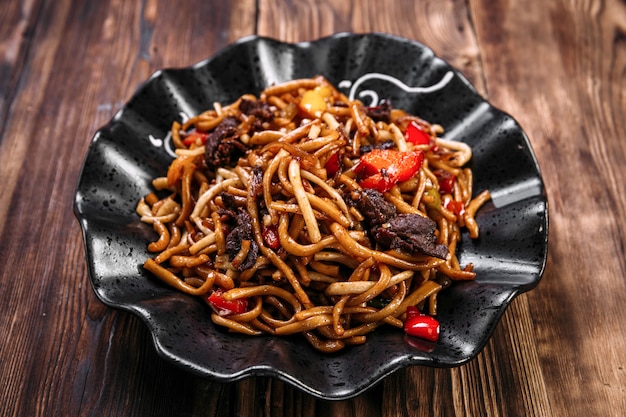 Uyghur cuisine dish tsomyan fried noodles beef