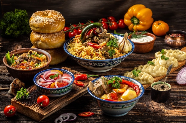uzbek and central asia cuisine concept. assorted uzbek food pilaf samsa lagman manti shurpa uzbek restaurant concept uzbek food