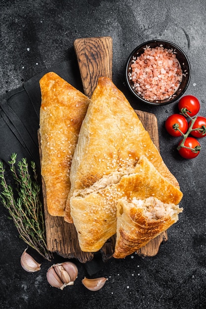 Uzbek and Central Asia samsa samosa pies Black background Top view