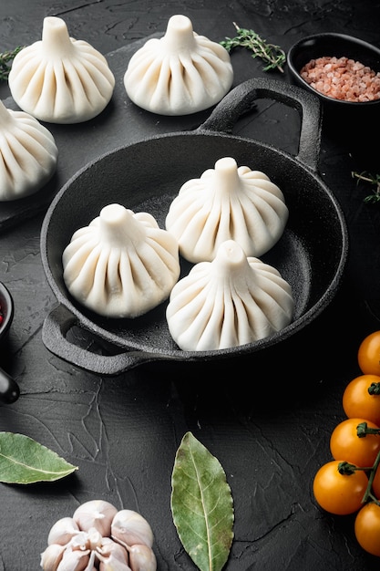 Uzbek Manti. Manti or manty dumplings, popular uzbekasian dish in frying cast iron pan