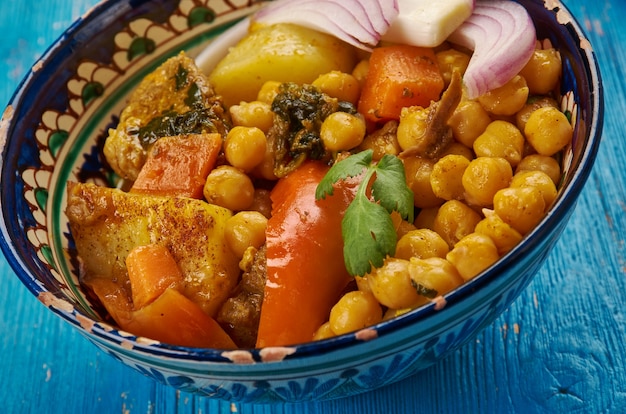 Uzbek soup with chickpeas mohora,nahot-shurpa.Central Asian cuisine.