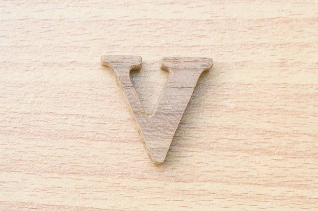 Photo v-alphabet letter from real wood.