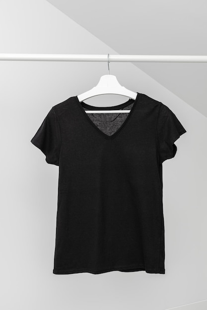 V neck tshirt hanging on Clothing rack Black color Template mock up