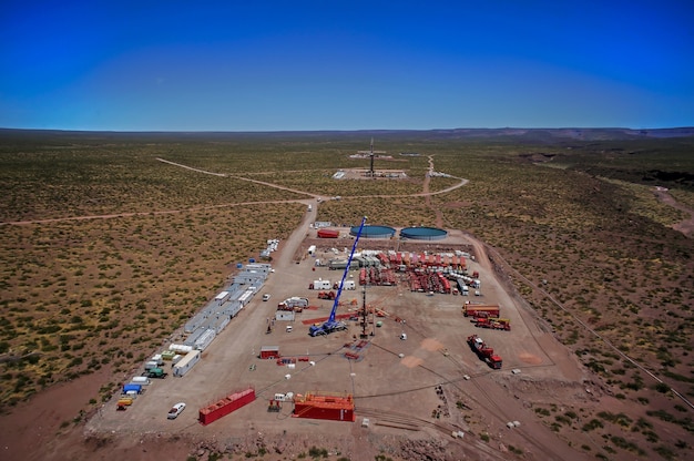 Vaca Muerta, Argentina, November 202, 2015: Extraction of unconventional oil. Battery of pumping trucks for hydraulic fracturing.