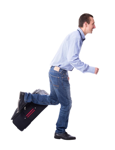 Vacation concept  side view of middle aged business man running with suitcase isolated on white