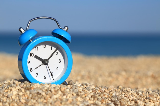 Vacation time Alarm clock on the beach