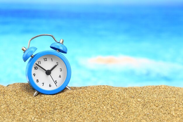 Vacation time Alarm clock on the sand