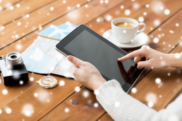 vacation, tourism, travel, technology and people concept - close up of traveler hands with blank tablet pc computer and map