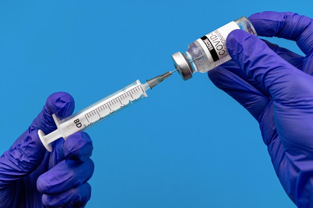 Vaccin voor immunisatie tegen COVID-19, achtergrondfoto van het coronaviruspreventieconcept