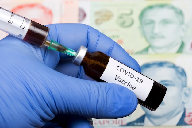 Vaccine against Covid-19 on the background of Singapore dollar