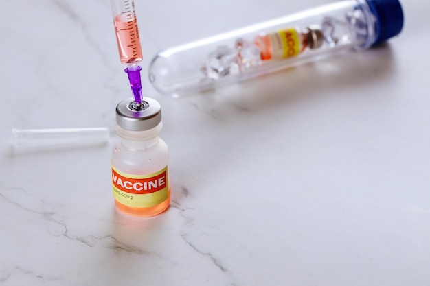 Vaccine to fight the of Covid-19 Coronavirus SARS-CoV-2 in the bottle sterile vial and syringe