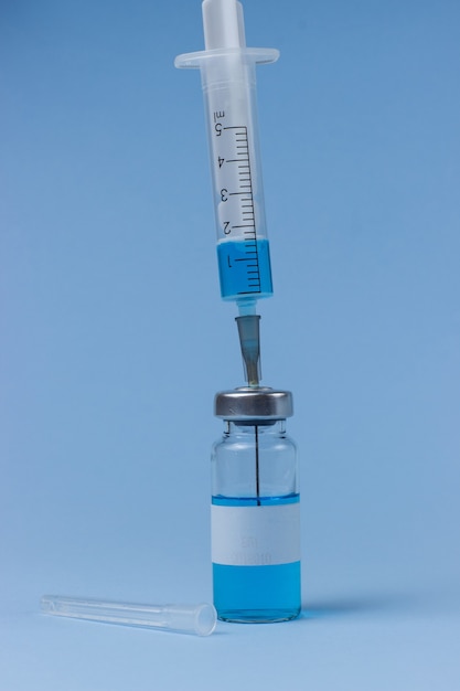 Vaccine in vials with syringe