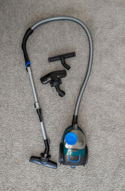 Photo vacuum cleaner brush on a gray rug