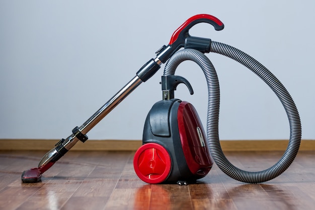 Photo vacuum cleaner stands on the floor