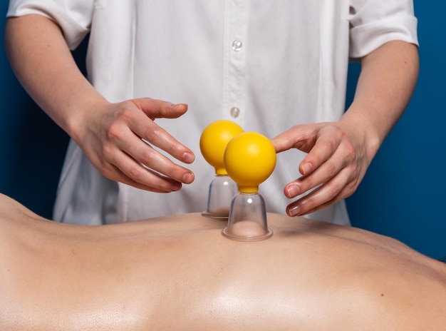 Vacuum relaxing massage in the spa studio