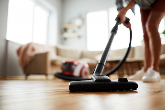 Vacuuming floor at home