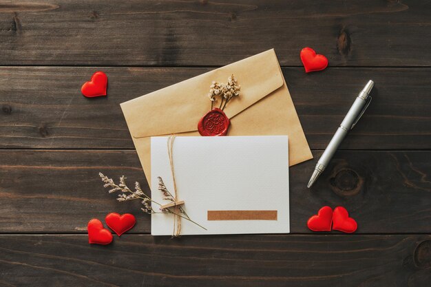 Valentine card with red heart on wooden background