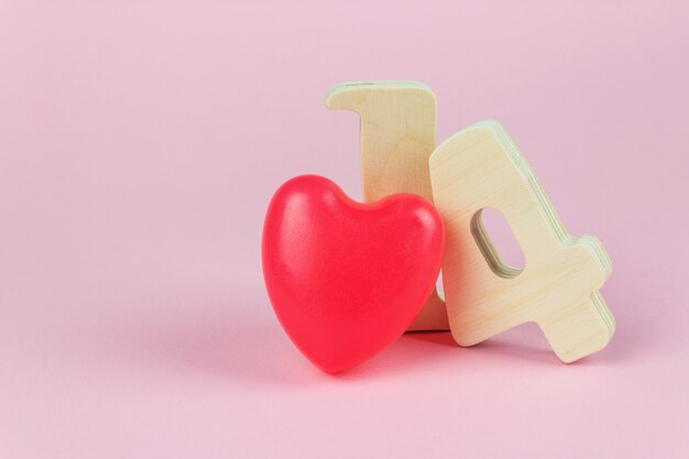 Valentine Concept. Valentine's day, 14, February, wooden numbers and red heart, copy space.