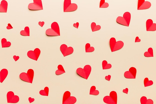 Valentine day background with red hearts top view with copy space