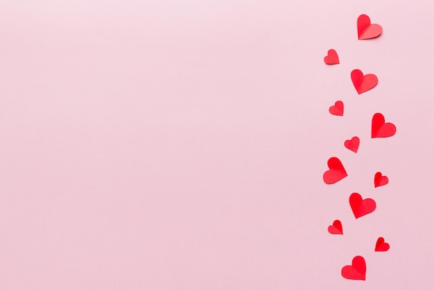 Valentine day background with red hearts top view with copy space