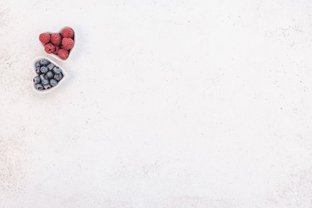 Valentine Day composition berries in heart plates