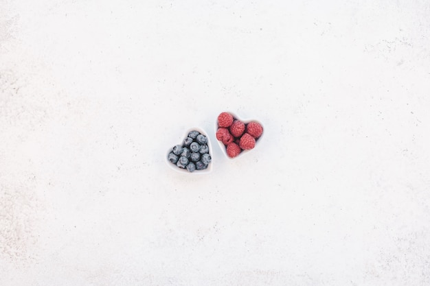 Valentine Day composition berries in heart plates