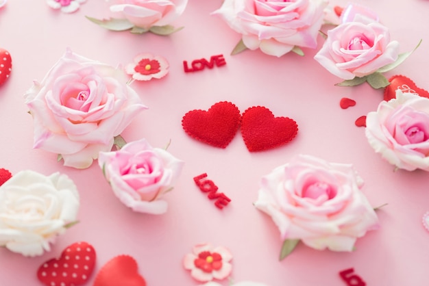 Valentine Day gift box with red hearts and roses on pink backgro